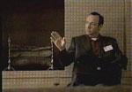 Larry in front of the fireplace